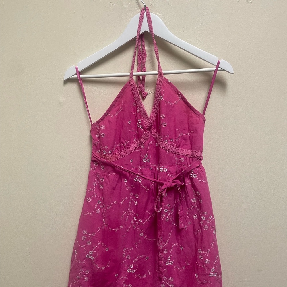 Pink y2k sundress with white embroidered flowers.